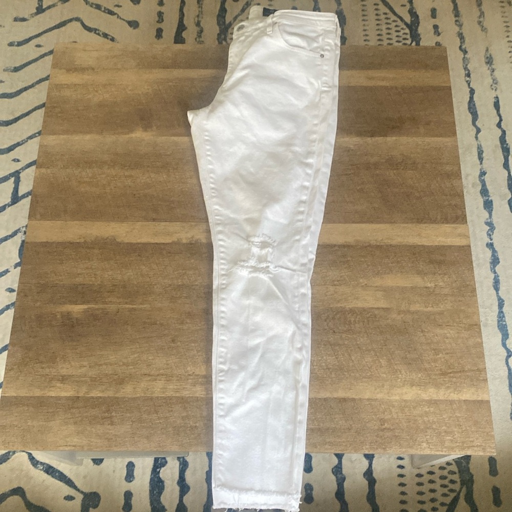 Jbrand skinny jeans with manufactured rips fringed bottoms